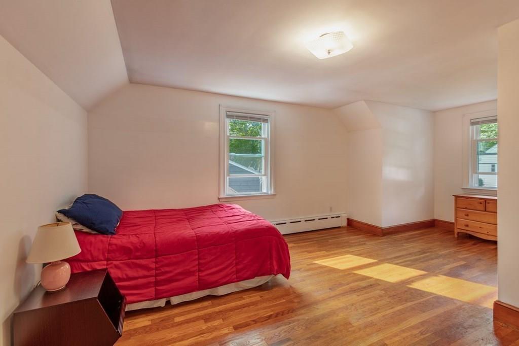 28 Pershing Avenue Framingham, MA 01702 - Photo 15 of 22 a bedroom with a bed and window