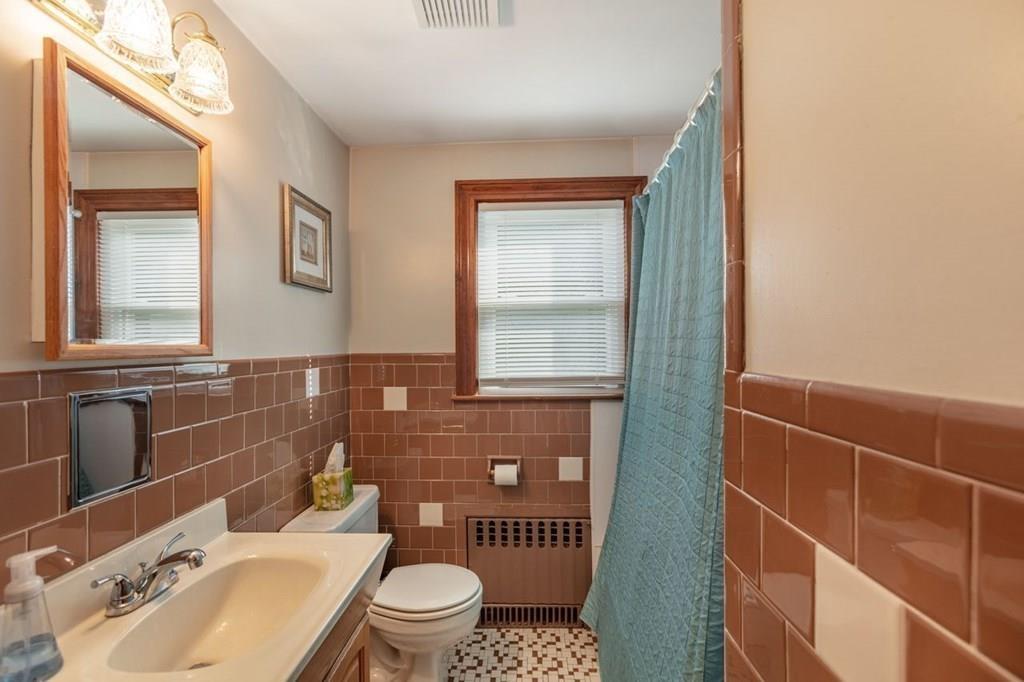 28 Pershing Avenue Framingham, MA 01702 - Photo 17 of 22 a bathroom with a sink toilet and shower