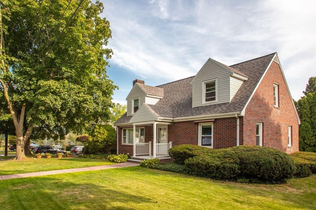 28 Pershing Avenue Framingham, MA 01702 - Photo 2 of 22 a front view of house with yard and green space
