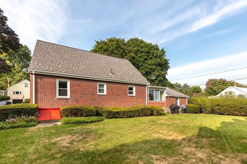 28 Pershing Avenue Framingham, MA 01702 - Photo 21 of 22 a front view of house with yard and garage