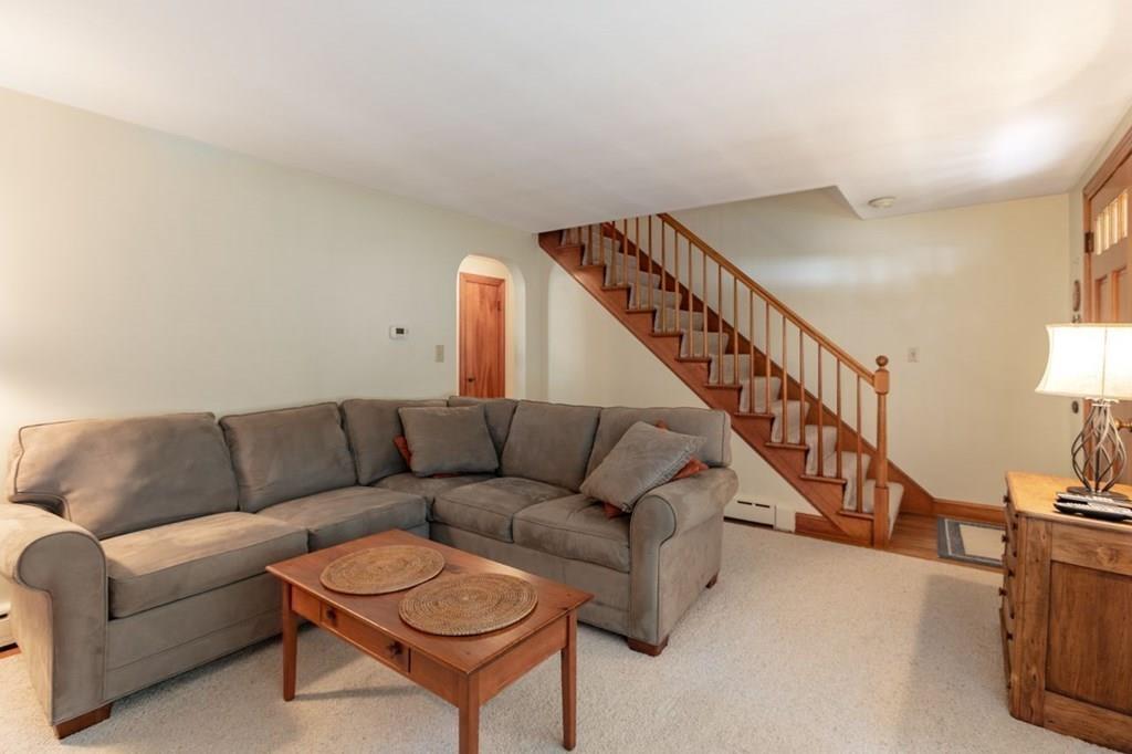 28 Pershing Avenue Framingham, MA 01702 - Photo 7 of 22 a living room with furniture and a stairs
