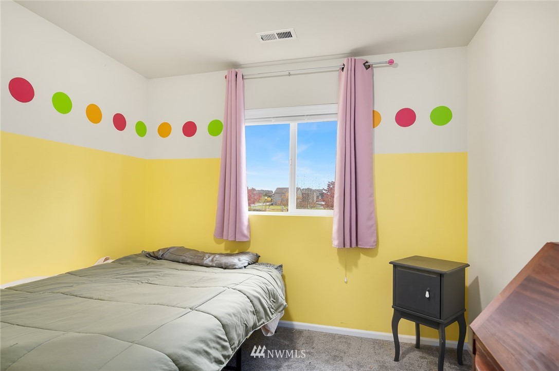 4738 Court R Tacoma, WA 98404 - Photo 23 of 32 a bedroom with a bed and a window