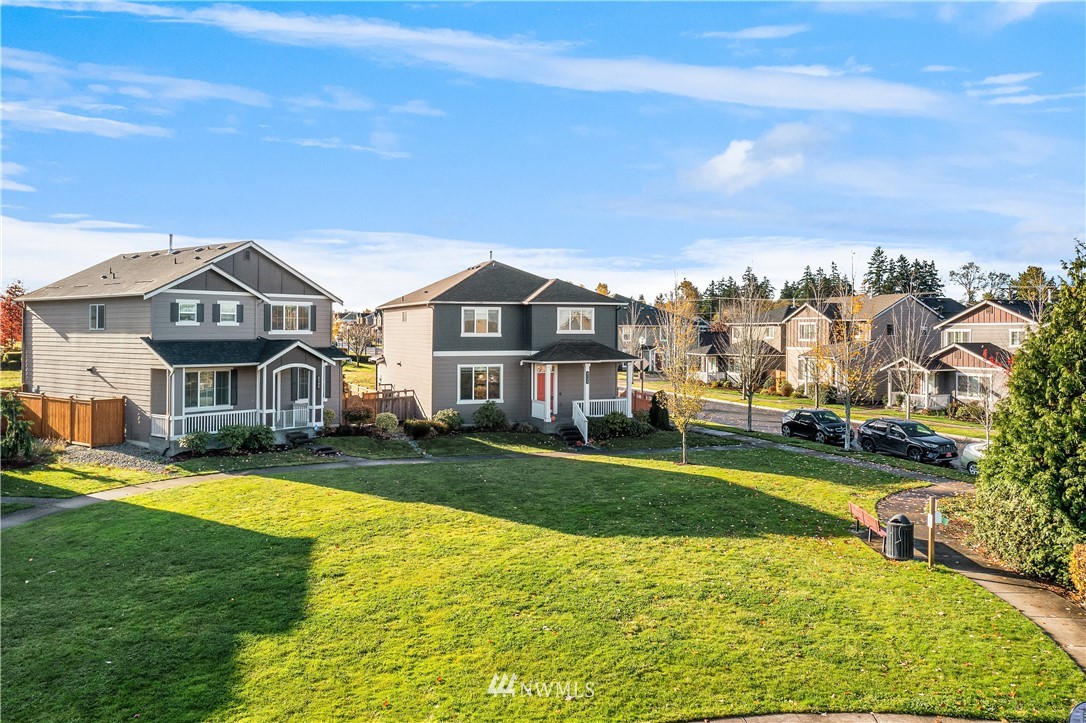 4738 Court R Tacoma, WA 98404 - Photo 28 of 32 a view of a big house with a big yard and potted plants