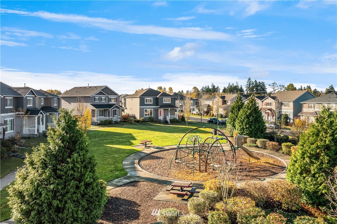 4738 Court R Tacoma, WA 98404 - Photo 3 of 32 a view of a swimming pool with a lake view