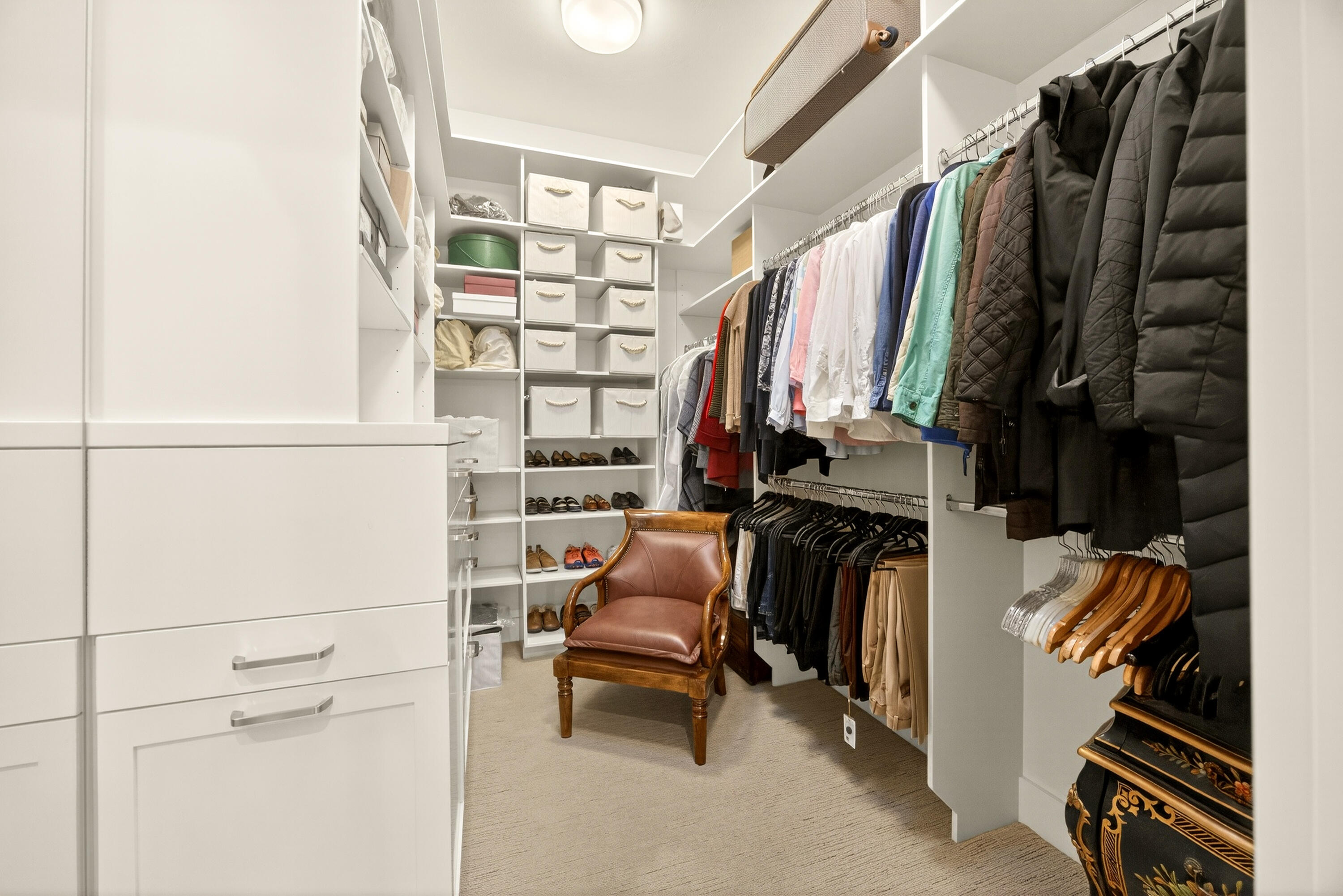 930 Granite Ridge Circle Jacksonville, OR 97530 - Photo 30 of 79 His & Hers walk-in closets with built-ins hamper, dresser and shelving.