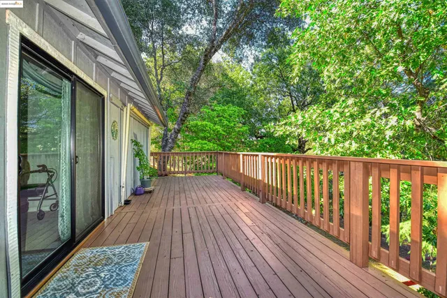 a view of balcony with wooden floor