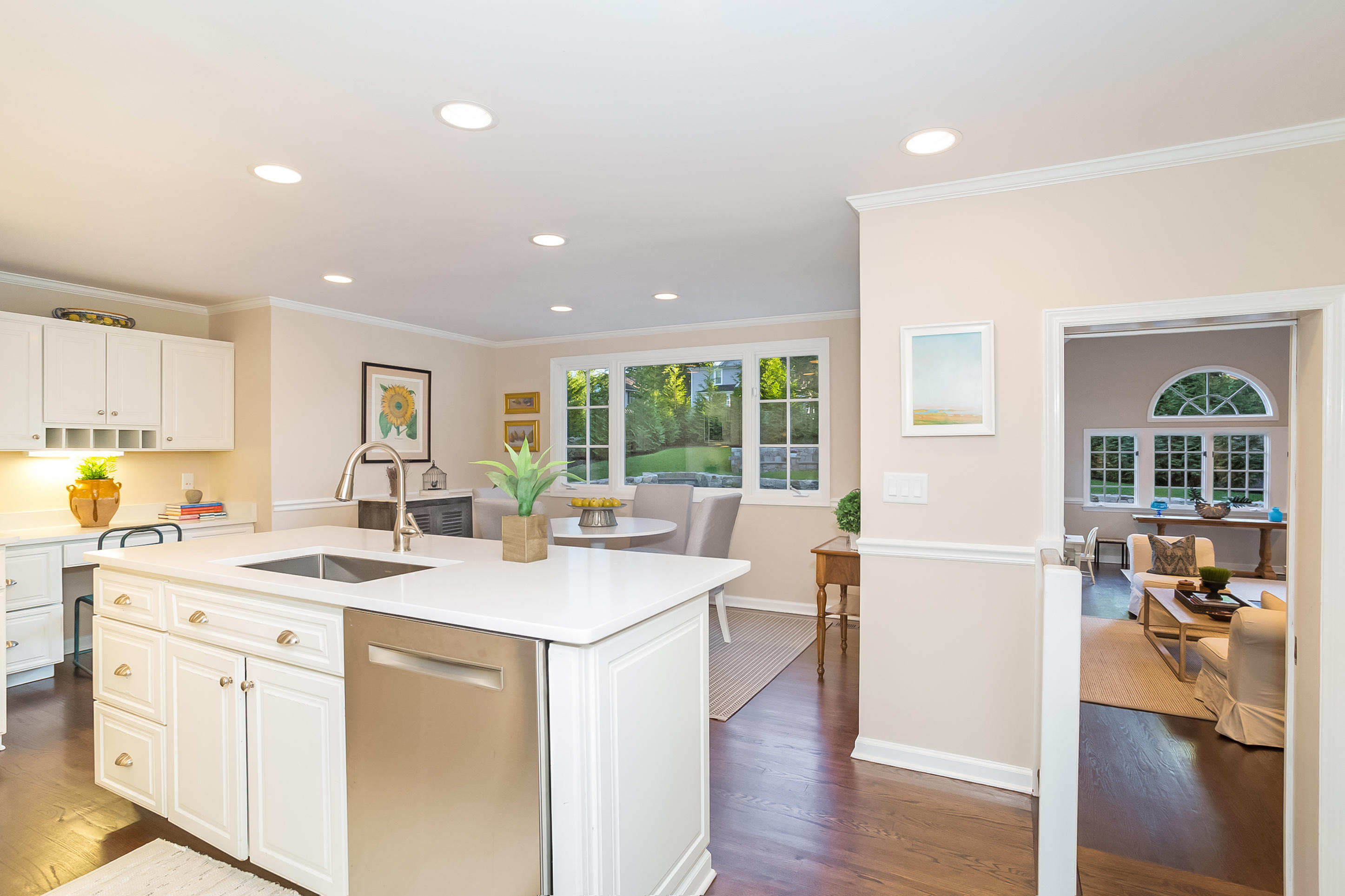 23 Rocaton Road Darien, CT 06820 - Photo 12 of 36 a open kitchen with a sink a stove and wooden floor