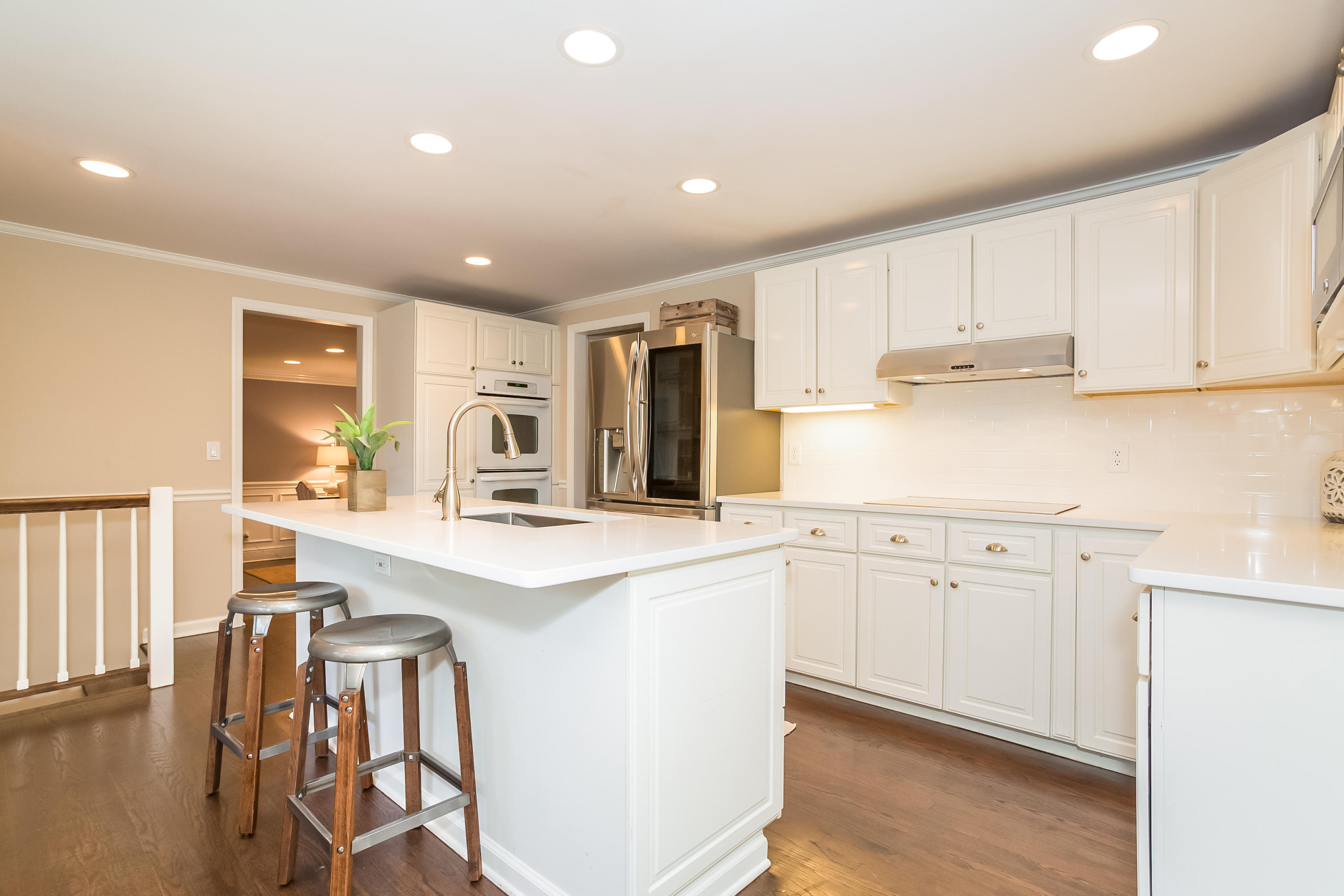 23 Rocaton Road Darien, CT 06820 - Photo 15 of 36 a kitchen with granite countertop white cabinets and white appliances