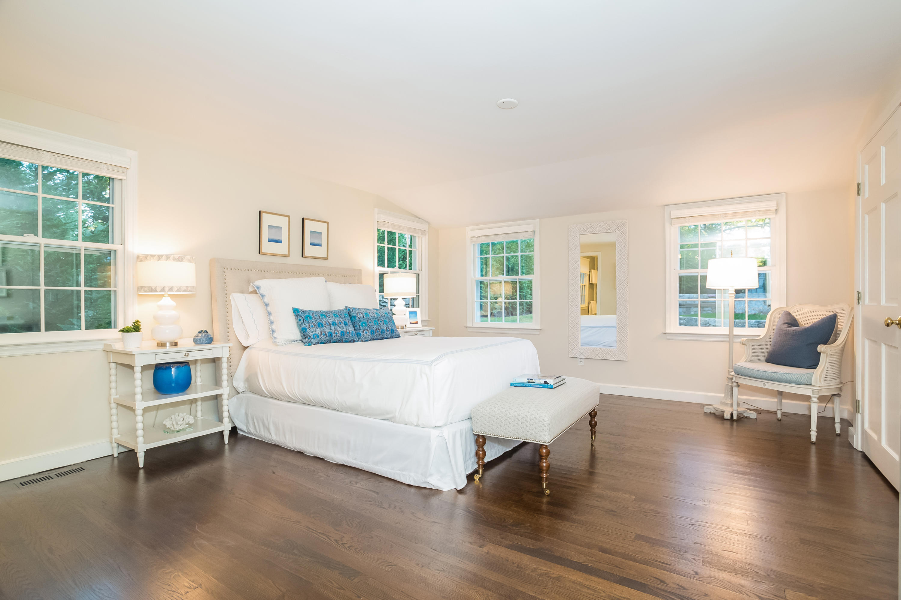 23 Rocaton Road Darien, CT 06820 - Photo 18 of 36 a spacious bedroom with a bed and a large window