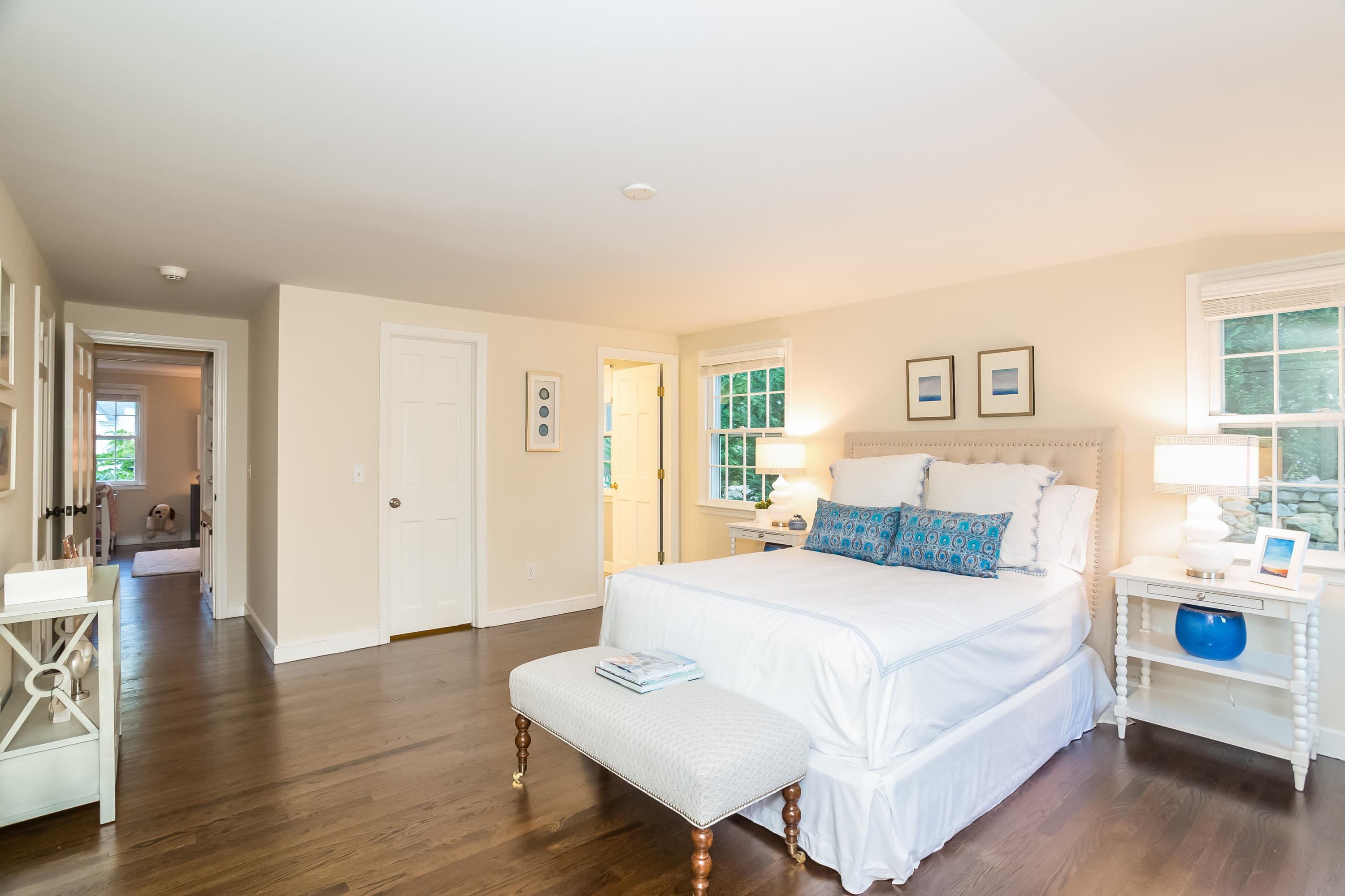 23 Rocaton Road Darien, CT 06820 - Photo 20 of 36 a bedroom with a bed and wooden floor