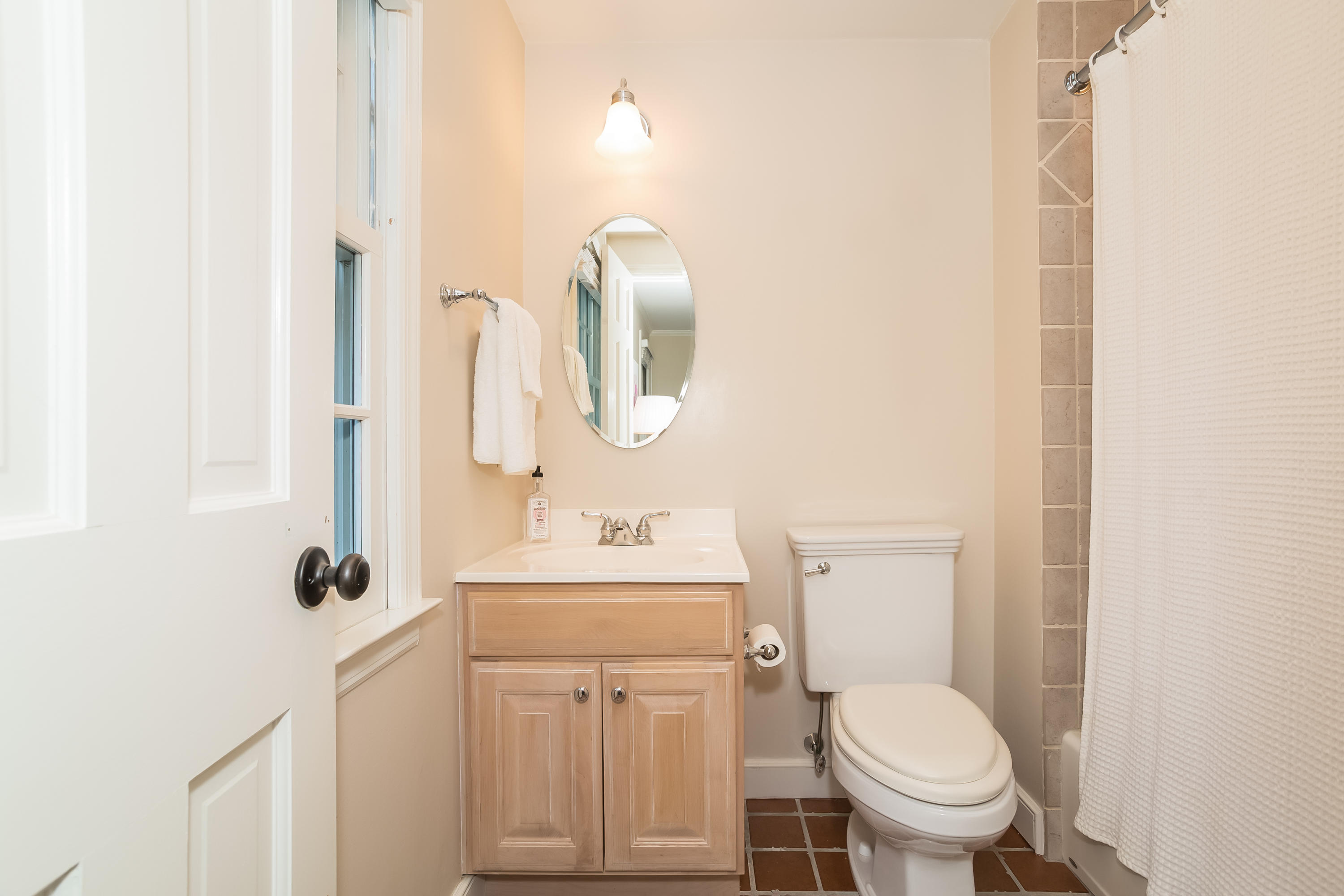 23 Rocaton Road Darien, CT 06820 - Photo 22 of 36 a bathroom with a toilet sink and mirror