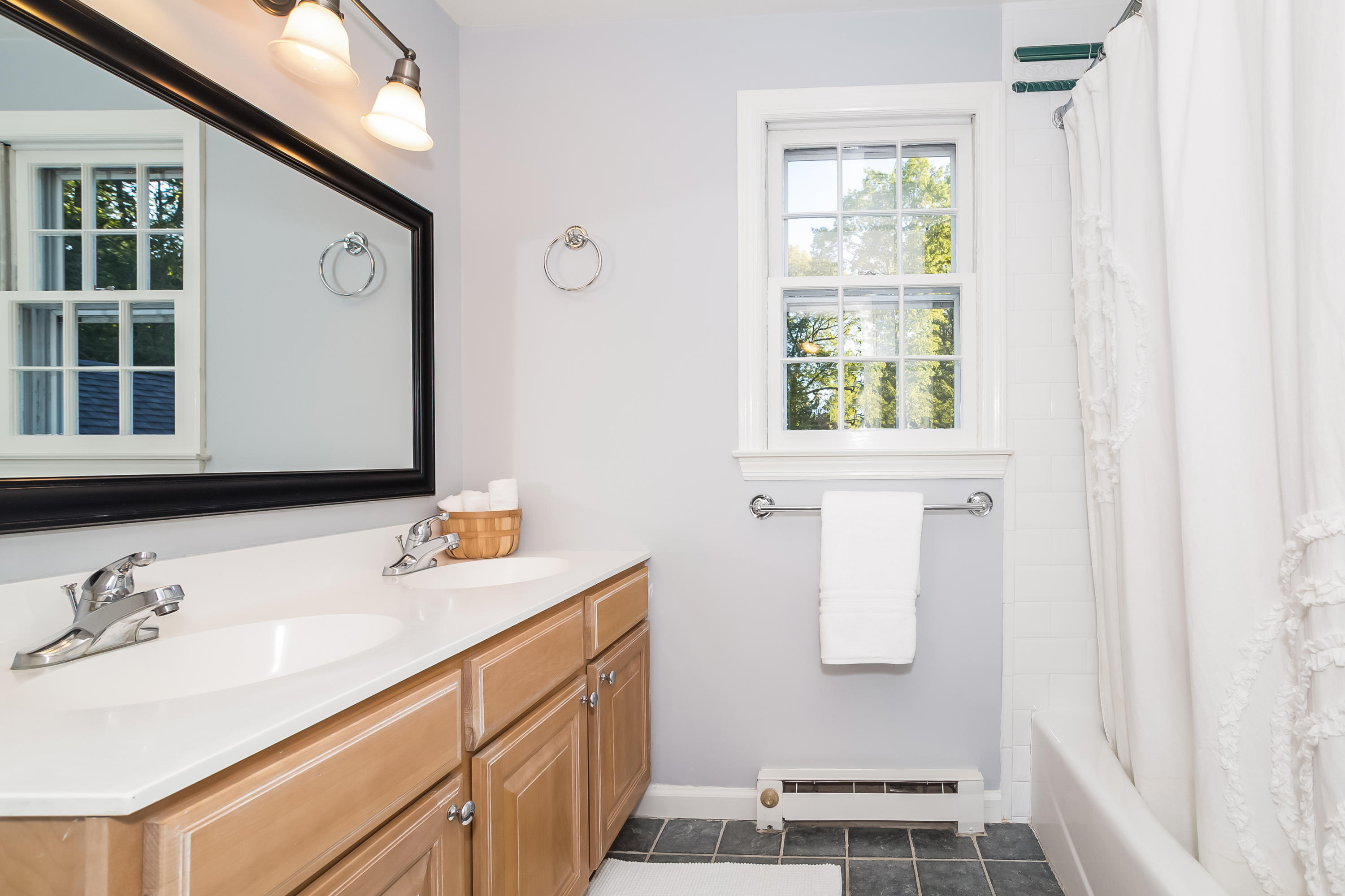 23 Rocaton Road Darien, CT 06820 - Photo 24 of 36 a bathroom with a sink and a mirror