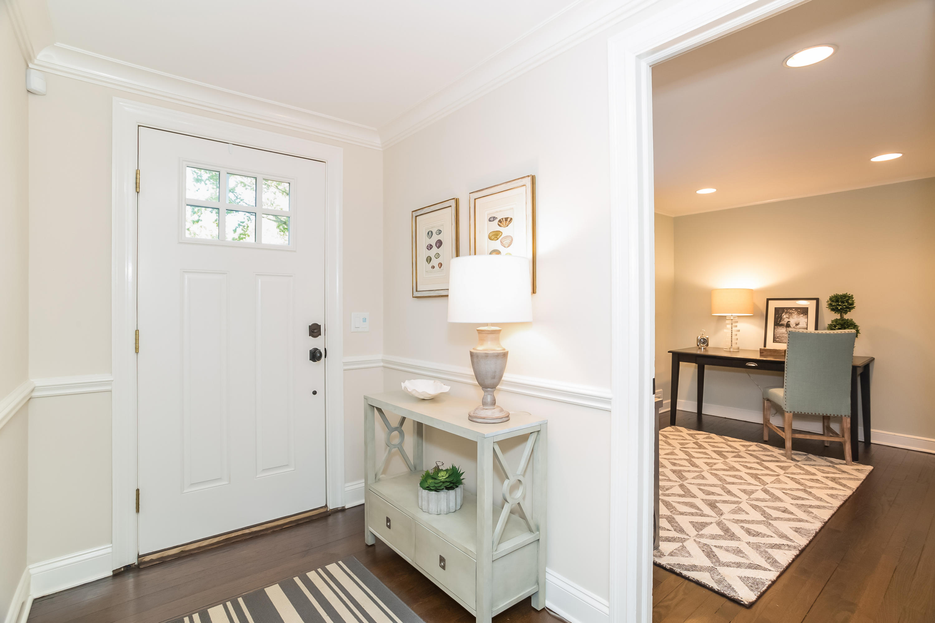 23 Rocaton Road Darien, CT 06820 - Photo 27 of 36 a living room with furniture and a table