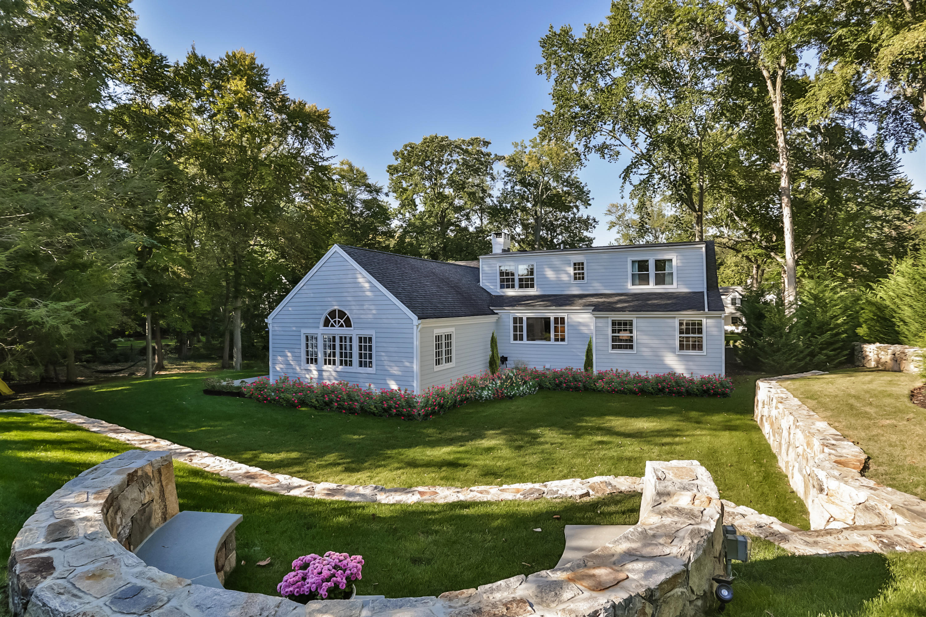 23 Rocaton Road Darien, CT 06820 - Photo 31 of 36 a house with a big yard and large trees