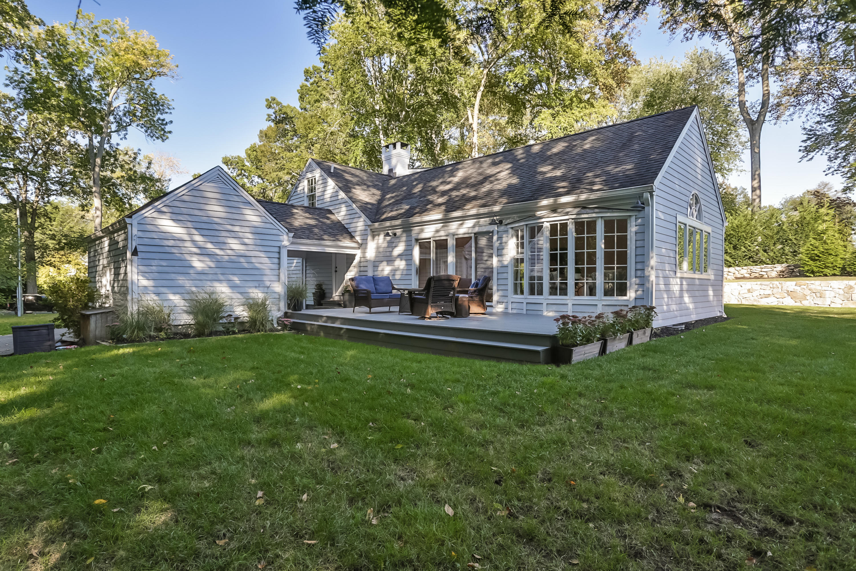 23 Rocaton Road Darien, CT 06820 - Photo 32 of 36 a view of a house with a backyard