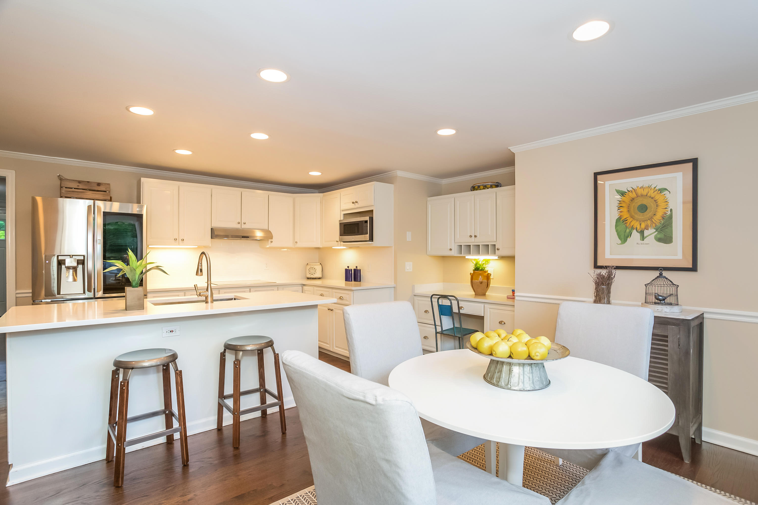 23 Rocaton Road Darien, CT 06820 - Photo 6 of 36 a large kitchen with a table and chairs