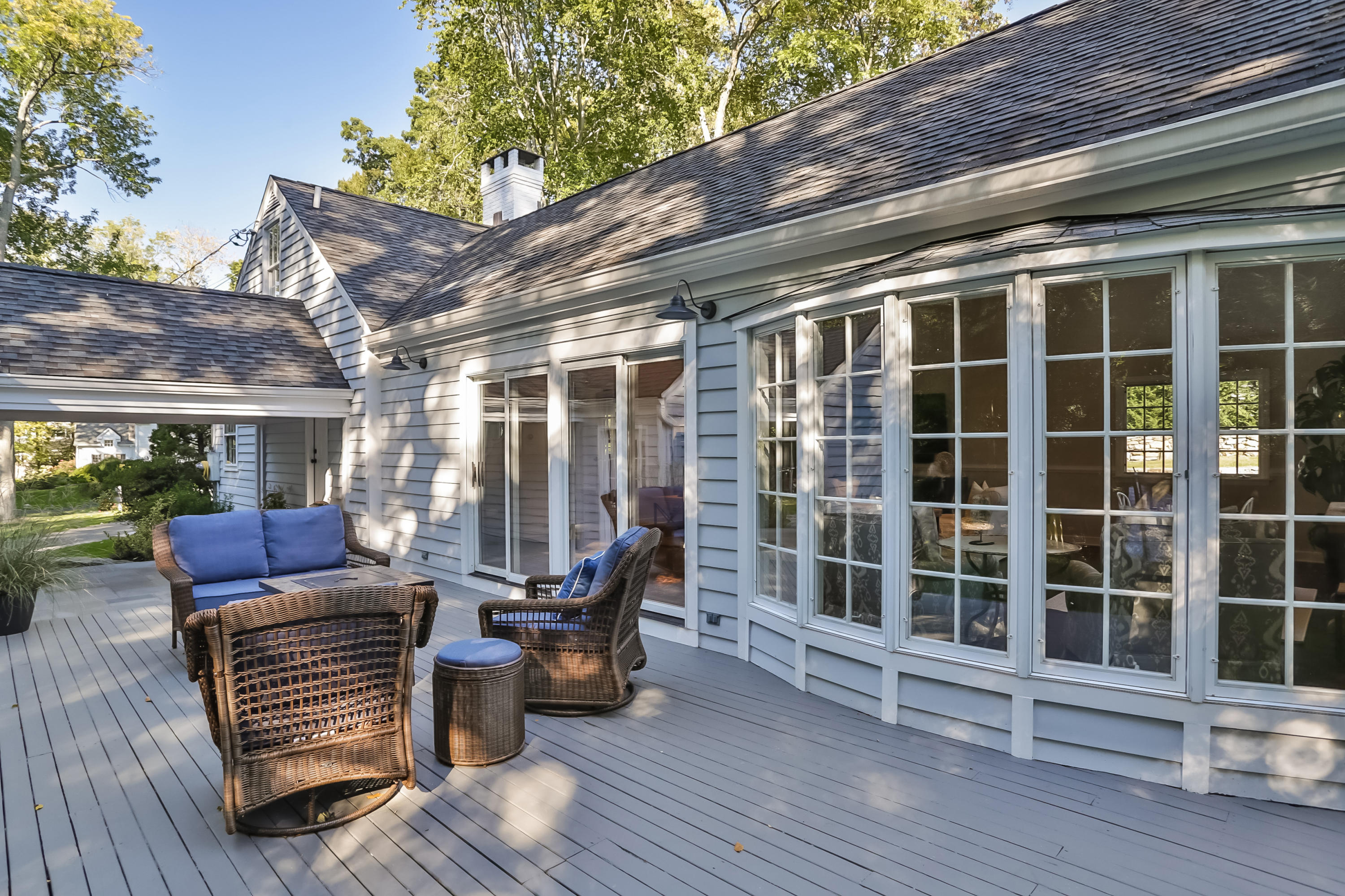 23 Rocaton Road Darien, CT 06820 - Photo 8 of 36 a view of a patio with table and chairs and wooden floor