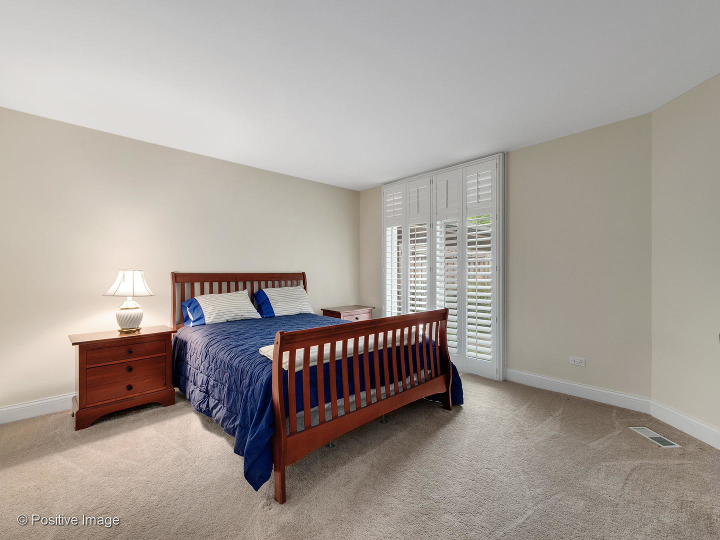1228 Indian Trail Road Hinsdale, IL 60521 - Photo 14 of 27 a bed sitting in a bedroom next to a window