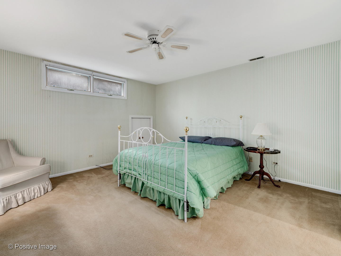 1228 Indian Trail Road Hinsdale, IL 60521 - Photo 18 of 27 a bedroom with a bed and a chandelier