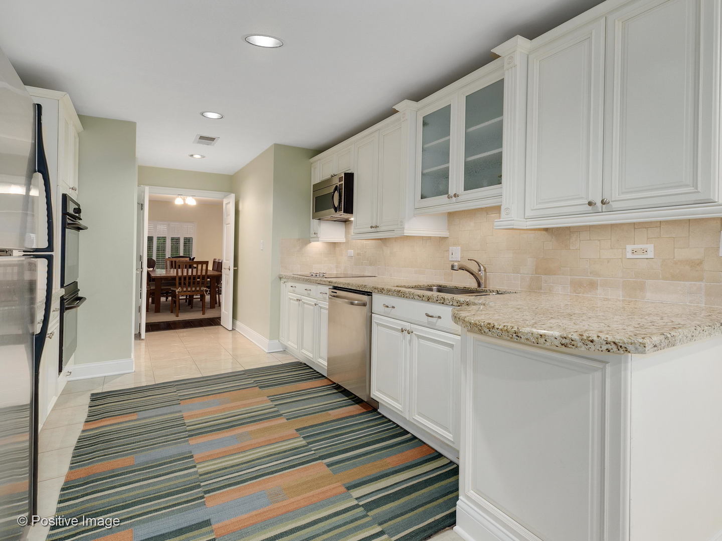 1228 Indian Trail Road Hinsdale, IL 60521 - Photo 10 of 27 a kitchen with granite countertop kitchen island a sink stainless steel appliances and cabinets