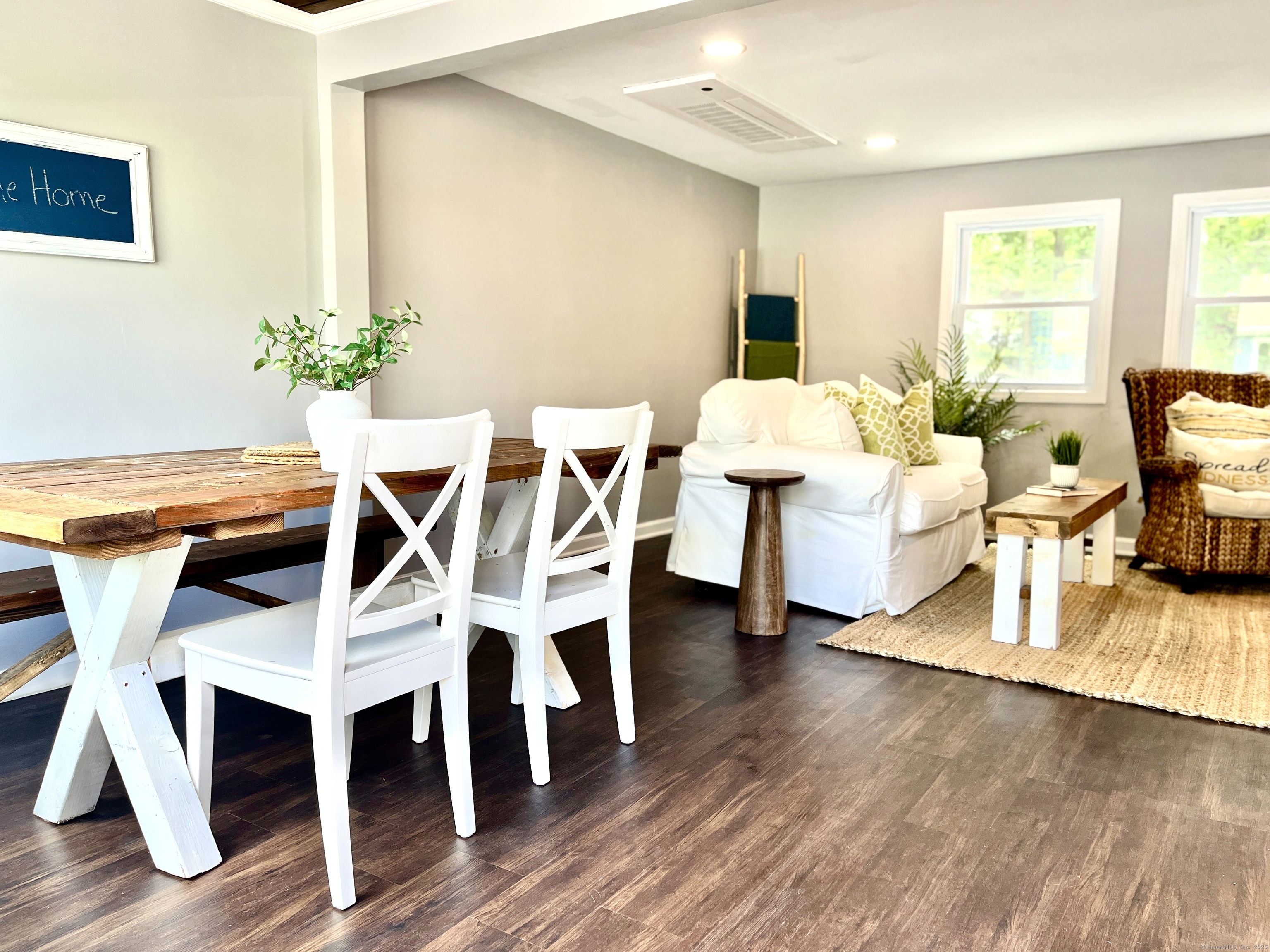 a view of a dining room with furniture and wooden floor