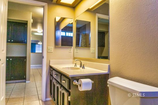 512 Amanda Street Ridgecrest, CA 93555 - Photo 22 of 44 a bathroom with a sink and a toilet