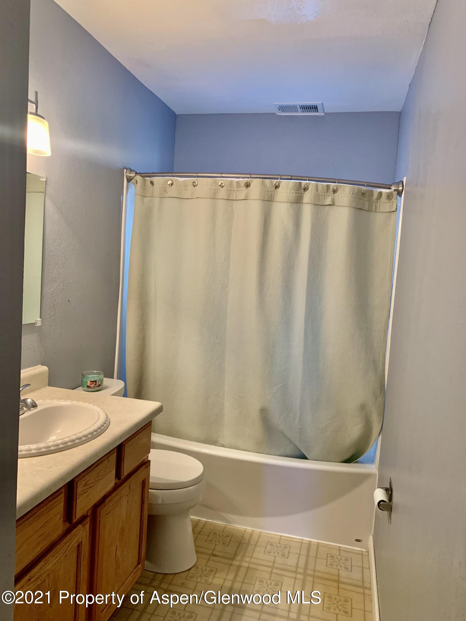 615 Ash Avenue Rifle, CO 81650 - Photo 17 of 24 a bathroom with a sink a toilet and shower
