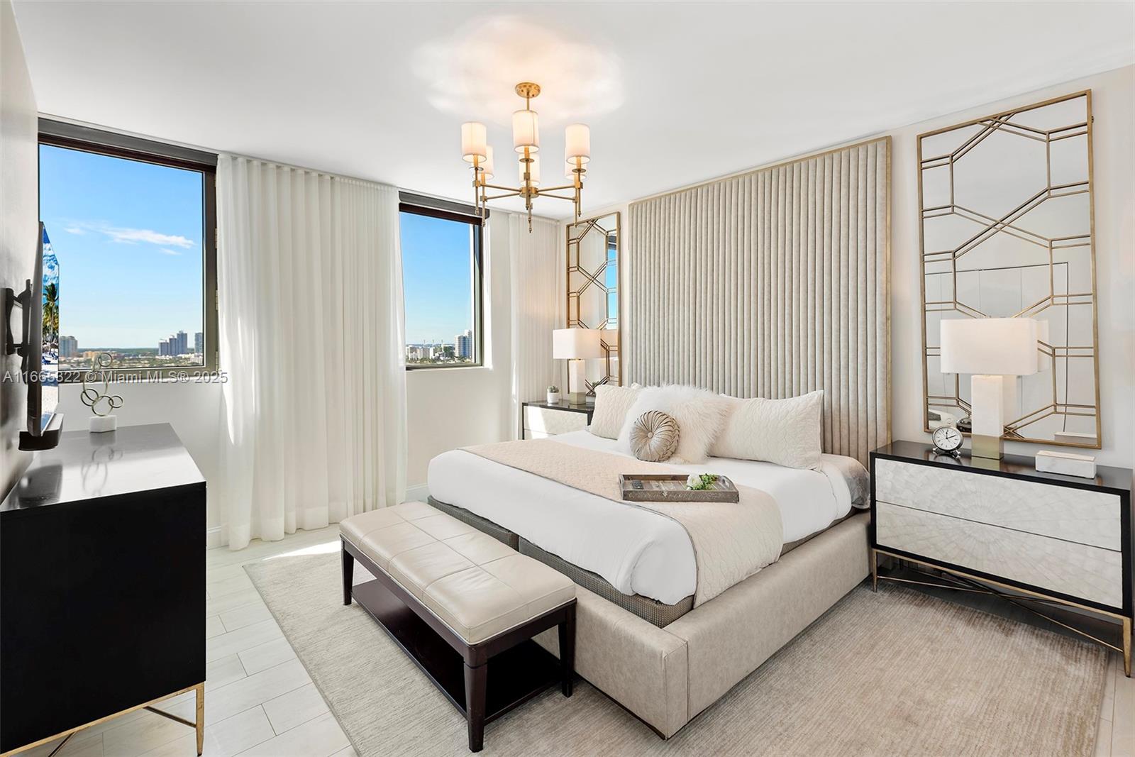 101 20th Street, Unit 2604 Miami Beach, FL 33139 - Photo 13 of 27 a living room with furniture and a chandelier