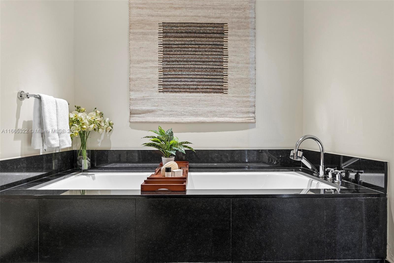 101 20th Street, Unit 2604 Miami Beach, FL 33139 - Photo 14 of 27 a bathroom with a sink and a bathtub