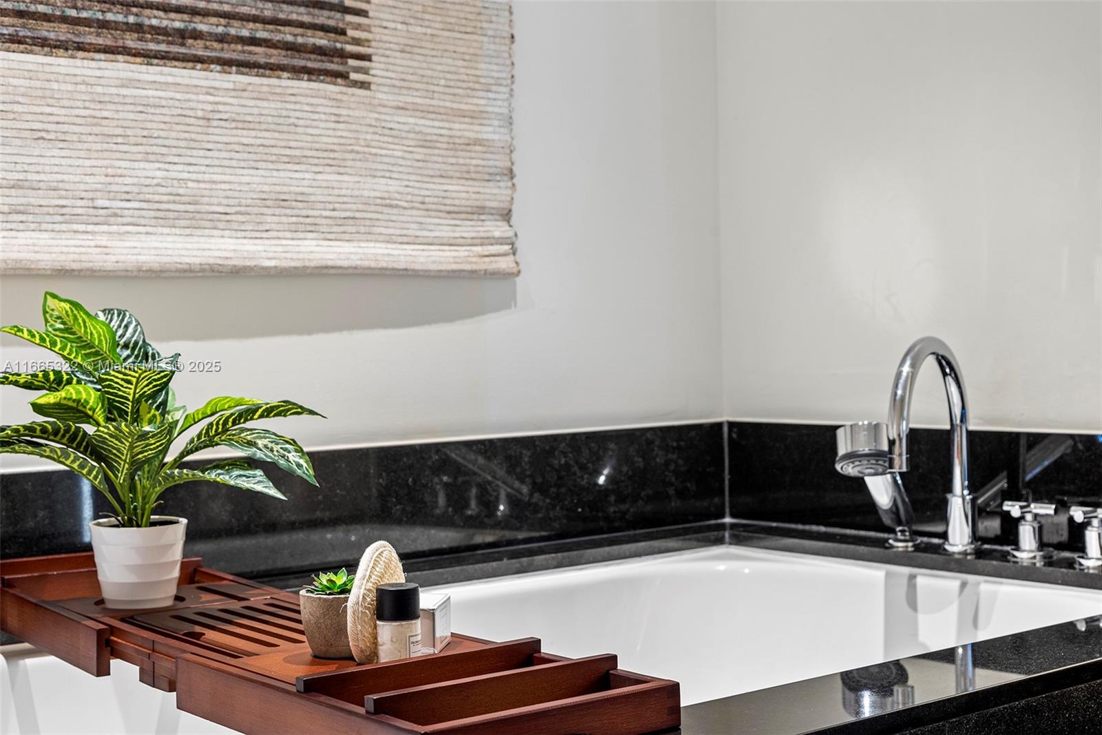 101 20th Street, Unit 2604 Miami Beach, FL 33139 - Photo 18 of 27 a closeup of a sink with a potted plant on it