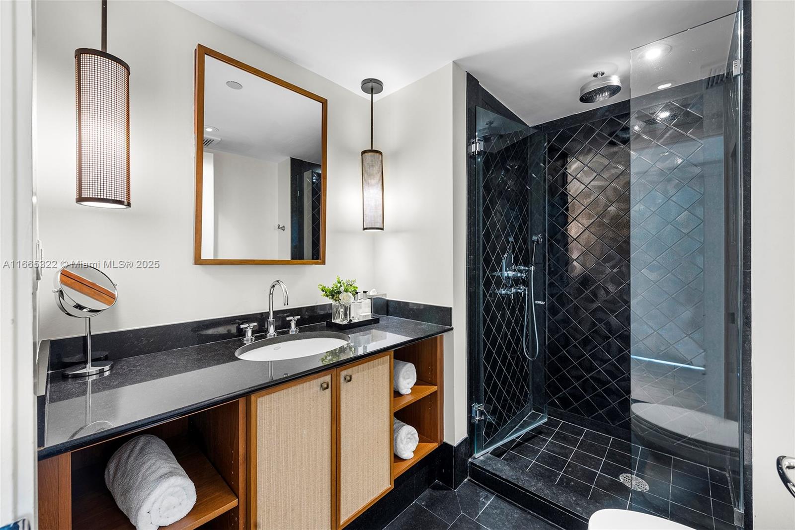 101 20th Street, Unit 2604 Miami Beach, FL 33139 - Photo 22 of 27 a bathroom with a sink and a mirror