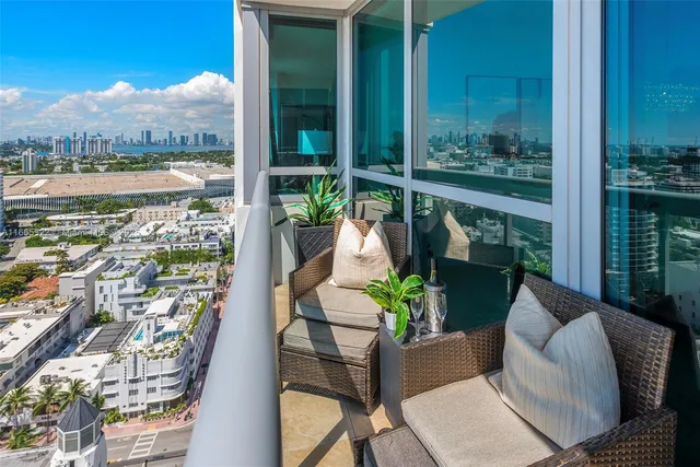 a view of balcony with furniture
