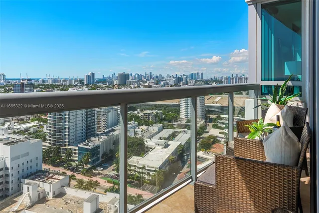 a view of a balcony with lake view and wooden floor
