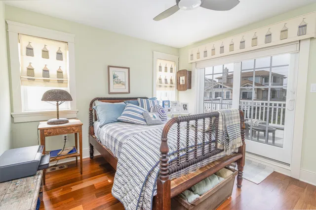a bathroom with a granite countertop toilet a sink and mirror