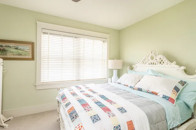 a bathroom with a granite countertop toilet a sink and a mirror