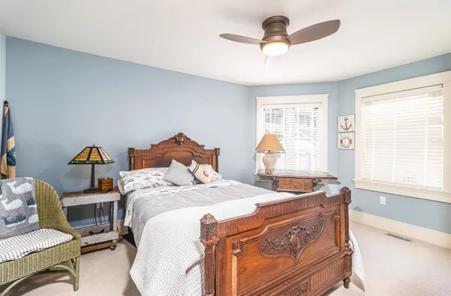 a balcony with furniture and wooden floor