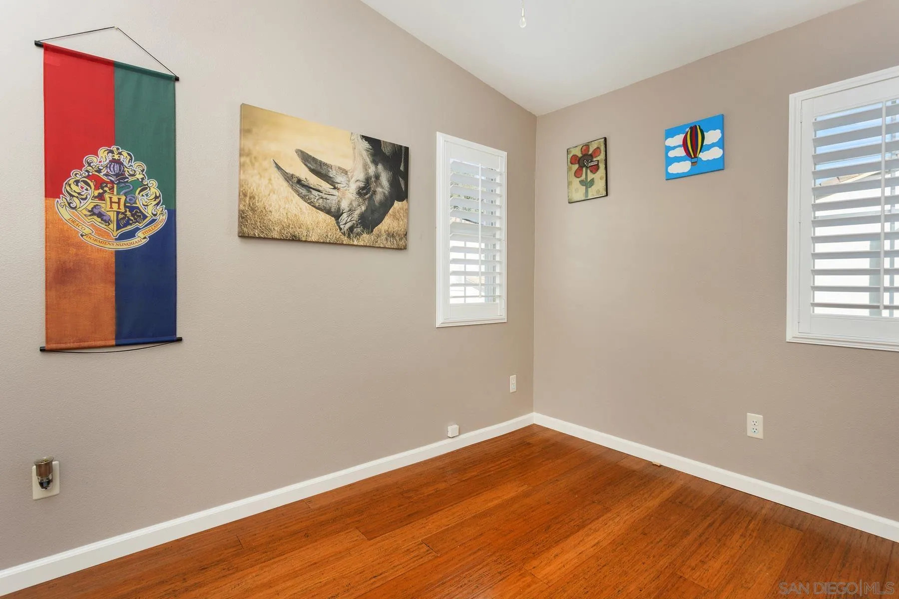 3142 Lamar Court Spring Valley, CA 91977 - Photo 13 of 16 a view of a bedroom with wooden floor and workspace