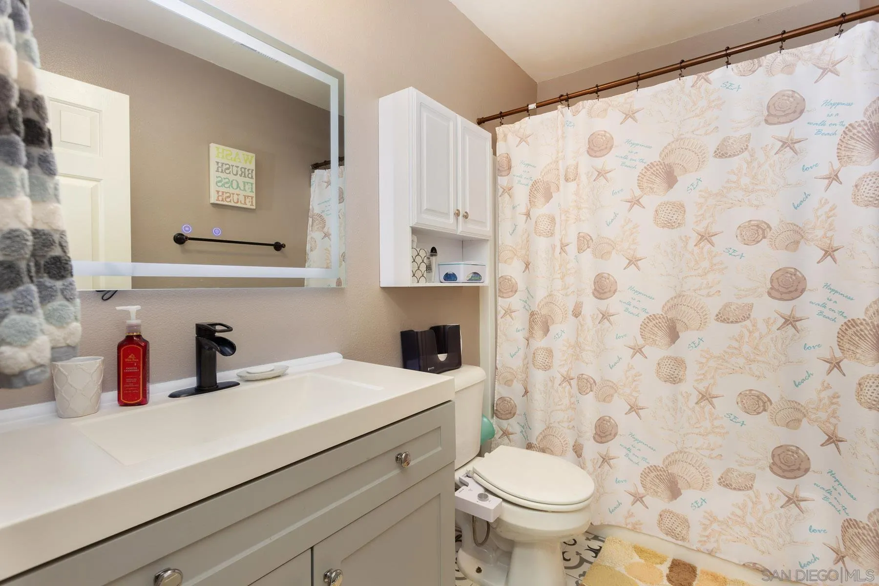 3142 Lamar Court Spring Valley, CA 91977 - Photo 14 of 16 a bathroom with a sink toilet and shower