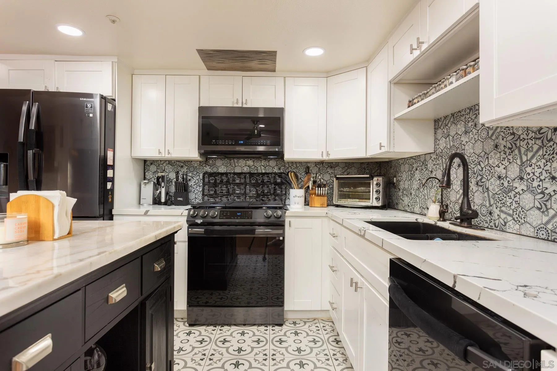 3142 Lamar Court Spring Valley, CA 91977 - Photo 5 of 16 a kitchen with a sink stove top oven and refrigerator
