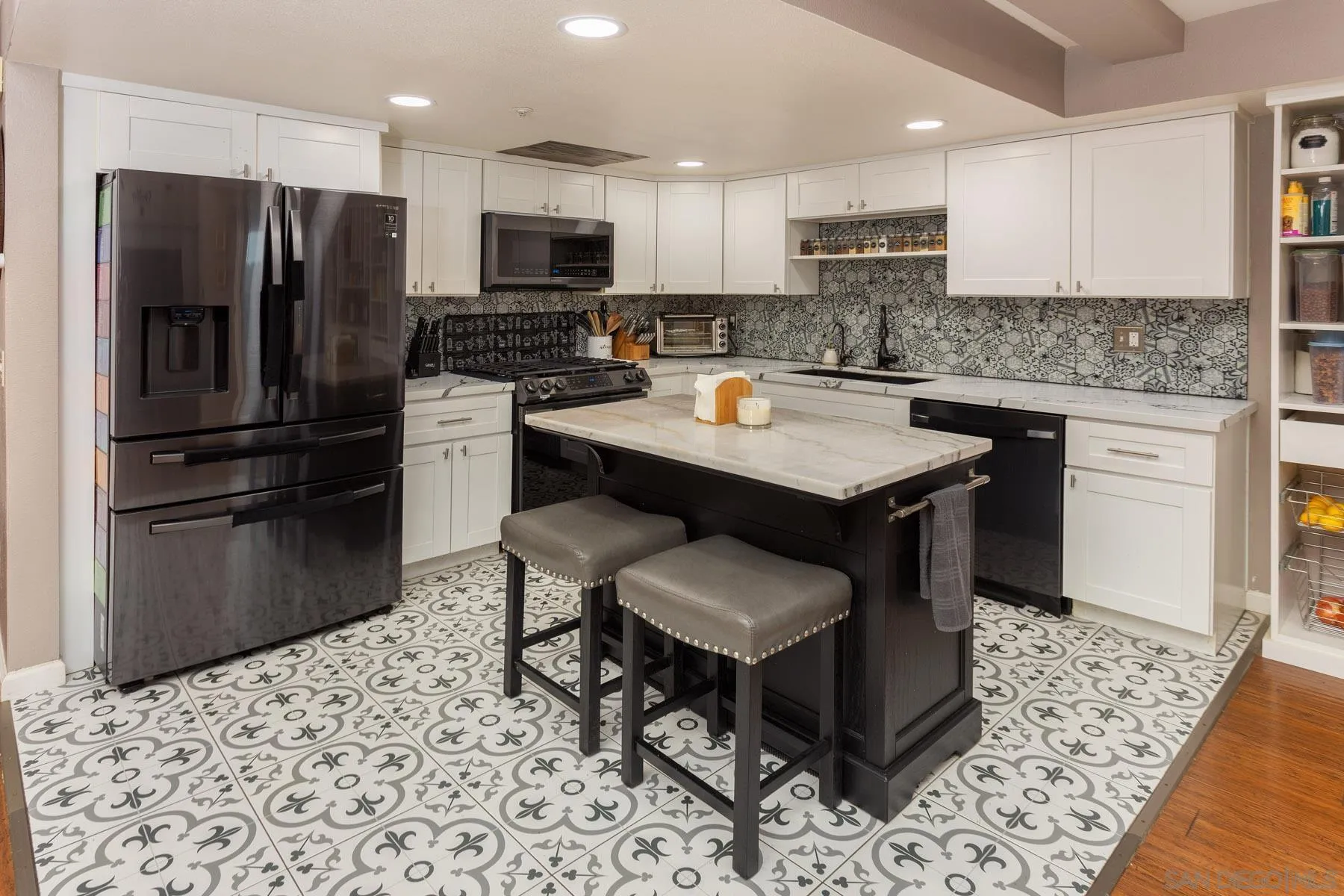 3142 Lamar Court Spring Valley, CA 91977 - Photo 8 of 16 a kitchen with a refrigerator sink and microwave