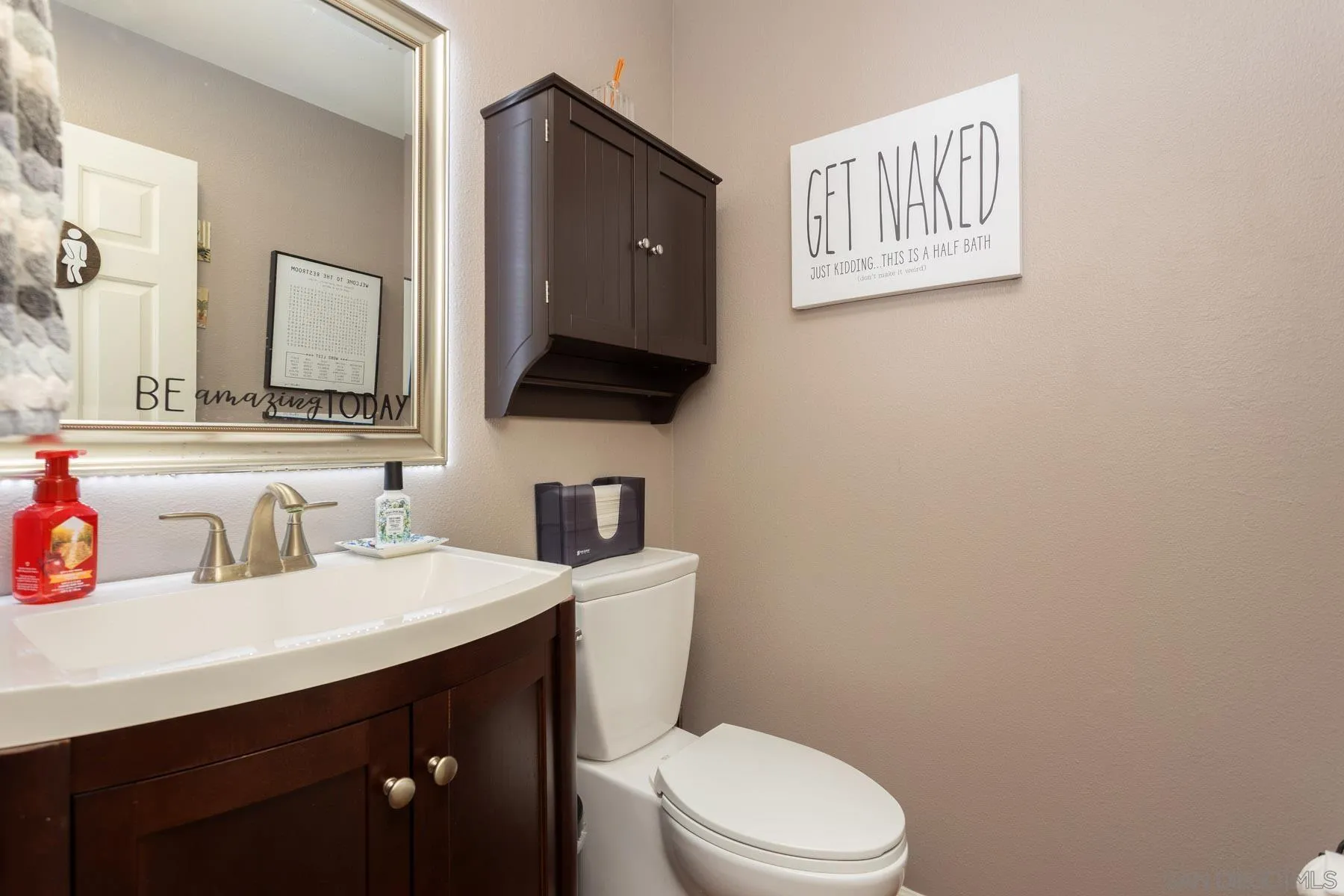 3142 Lamar Court Spring Valley, CA 91977 - Photo 10 of 16 a bathroom with a toilet sink and mirror