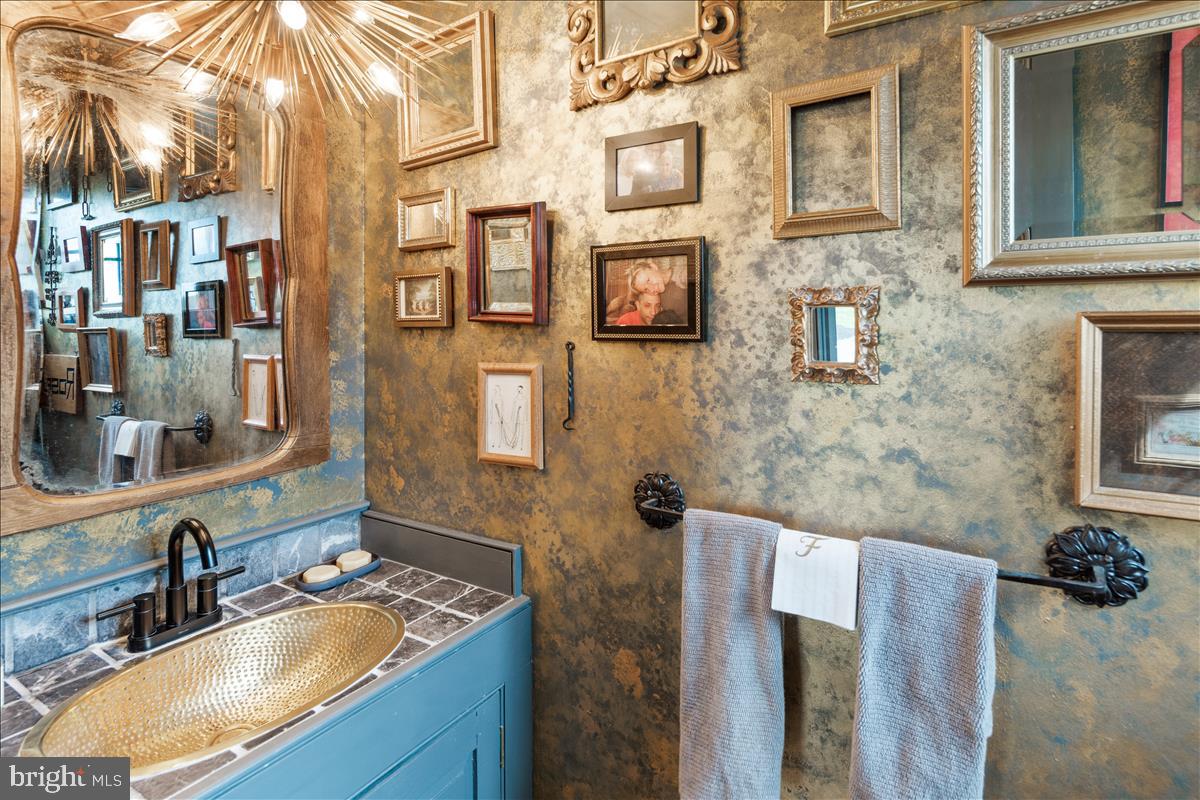 2753 Rushland Road Jamison, PA 18929 - Photo 14 of 60 a bathroom with a granite countertop double vanity and a mirror
