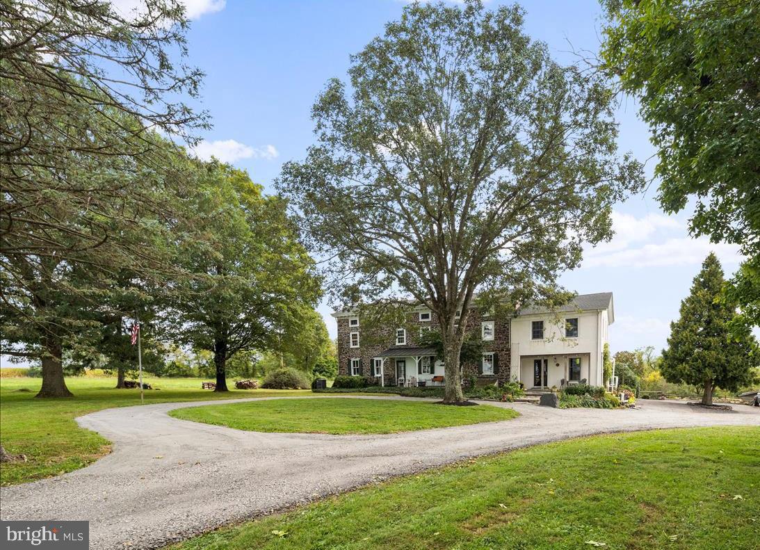 2753 Rushland Road Jamison, PA 18929 - Photo 2 of 60 a view of a white house in a big yard with large trees