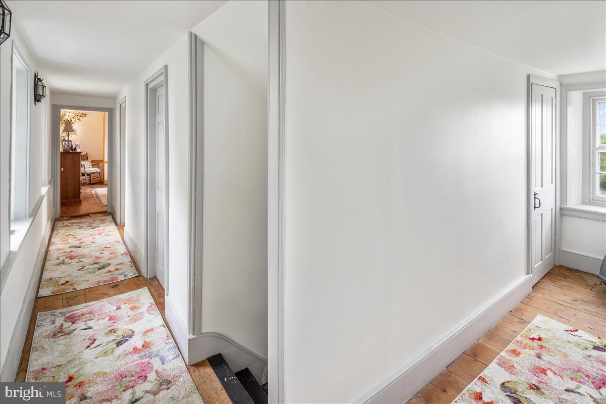 2753 Rushland Road Jamison, PA 18929 - Photo 26 of 60 a view of a hallway with wooden floor and a bedroom