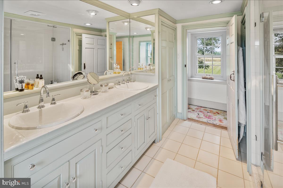 2753 Rushland Road Jamison, PA 18929 - Photo 27 of 60 a spacious bathroom with a double vanity sink a mirror and a shower