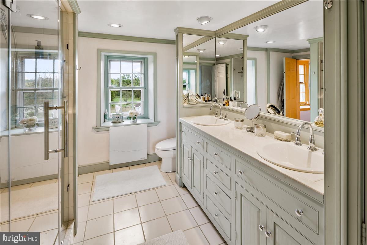 2753 Rushland Road Jamison, PA 18929 - Photo 28 of 60 a spacious bathroom with a double vanity sink a mirror and a shower