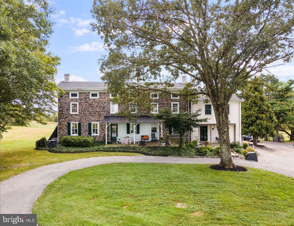 2753 Rushland Road Jamison, PA 18929 - Photo 3 of 60 a front view of a building with a garden