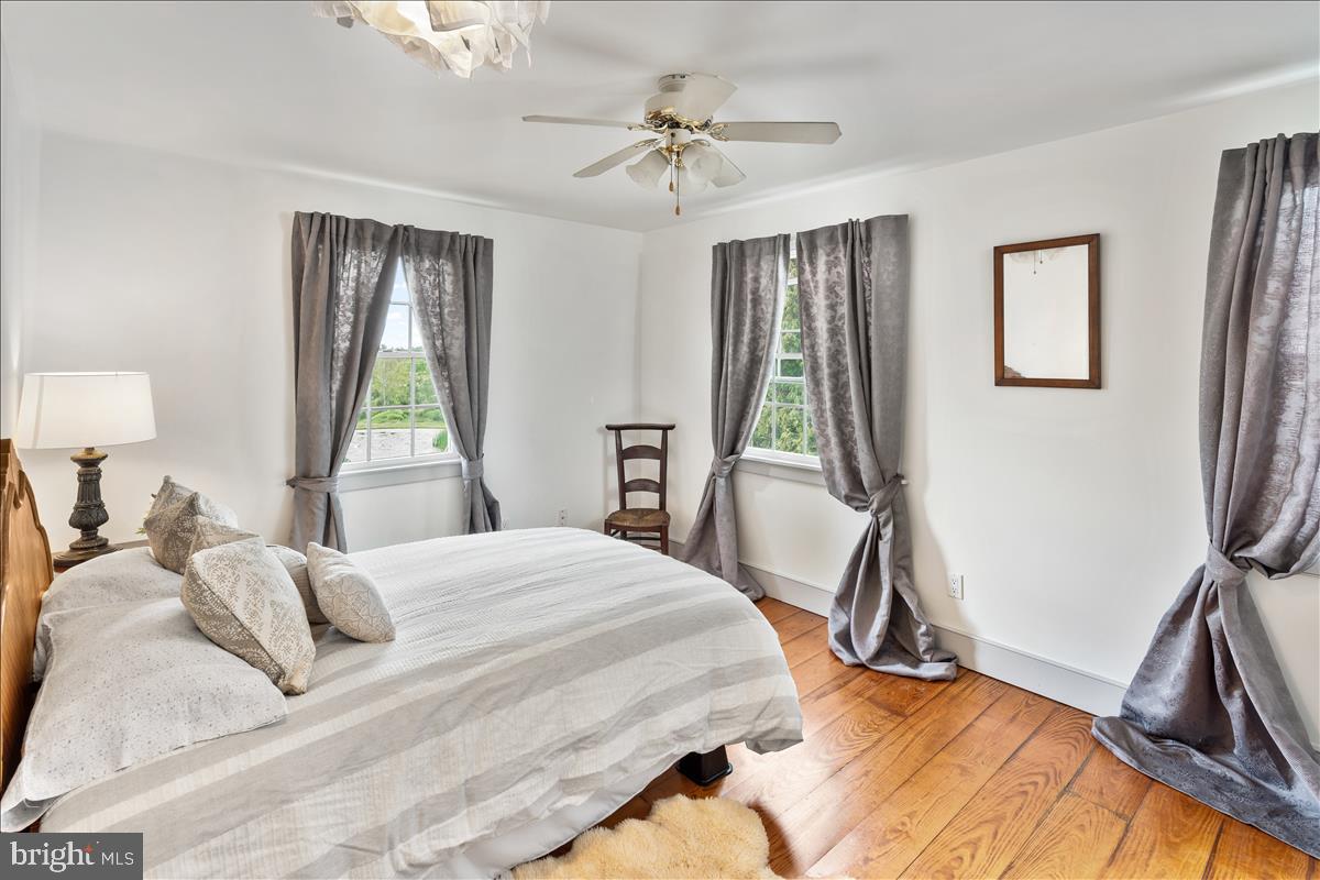 2753 Rushland Road Jamison, PA 18929 - Photo 33 of 60 a bedroom with a bed and a chandelier