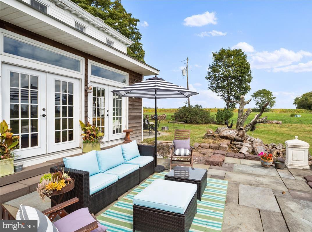 2753 Rushland Road Jamison, PA 18929 - Photo 38 of 60 a view of a patio with couches dining table and chairs with garden view