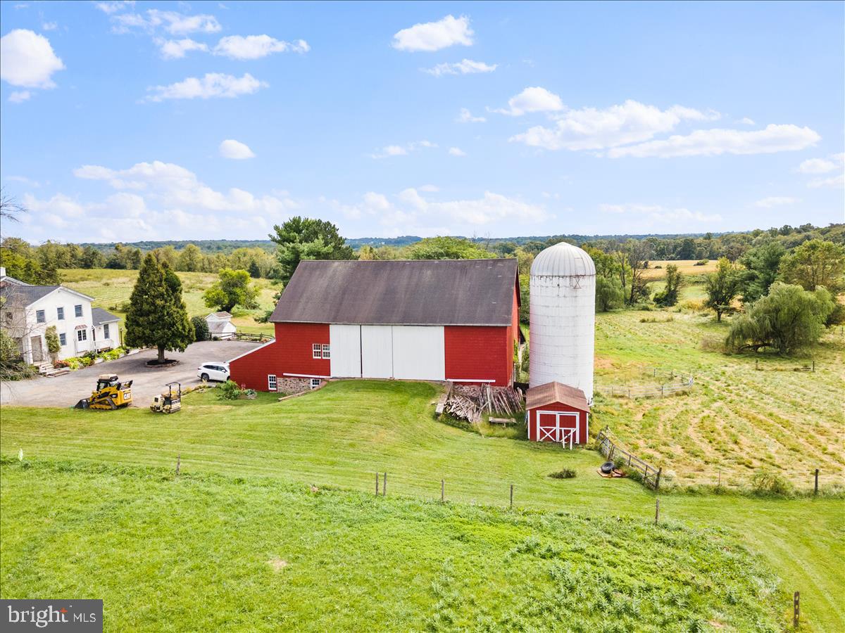 2753 Rushland Road Jamison, PA 18929 - Photo 50 of 60 a view of a garden with lawn chairs and a large tree